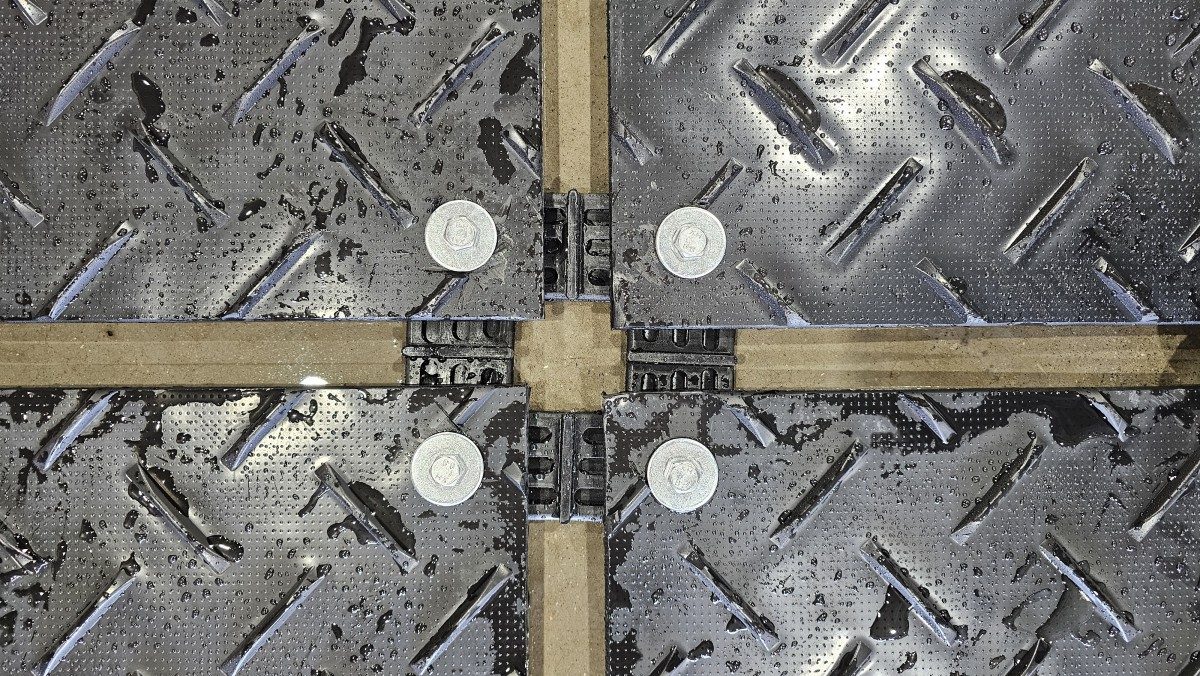 Connector hardware installed on ground mat